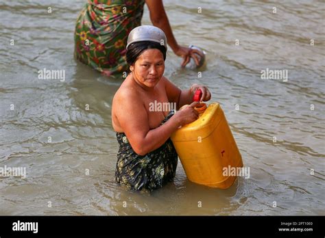 Burmese Woman Bathing And Washing During Southeast Asia Heatwave Life