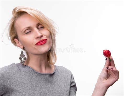Portrait Of A Woman Enjoying Eating Strawberries Stock Image Image Of