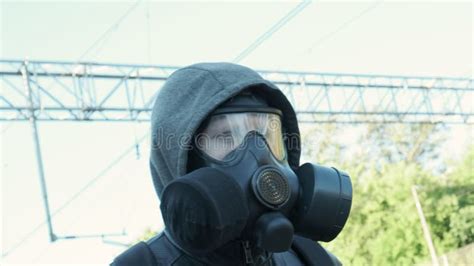 Man In Gas Mask At Epidemic Standing Outdoors Chemical Weapon Virus