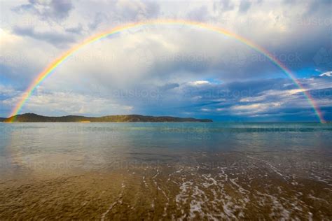 Image Of Rainbow Over Ocean And Sandy Beach Austockphoto