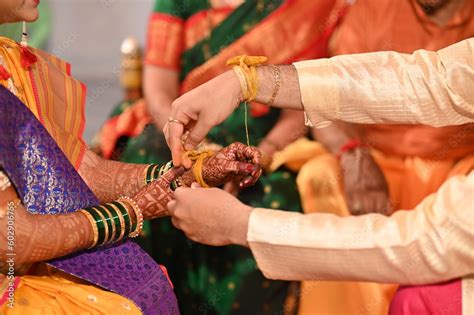 Kanyaadan Ceremony Wearing Turmeric Thread On Hand Of Bride Marathi