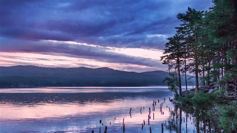 Landscape View Of Mountains Coast Trees Forest Under Clouds Blue Sky