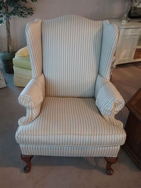 Faux bamboo accents frame the couch around the bottom and sides, with brass on each corner. ETHAN ALLEN WINGBACK CHAIR | Delmarva Furniture Consignment