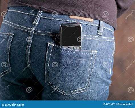 Abstract Mobile Phone In The Back Pocket Of Jeans Stock Photo Image