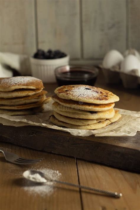 Stacks Of Gluten Free Pancakes With Blackcurrant And Icing Sugar