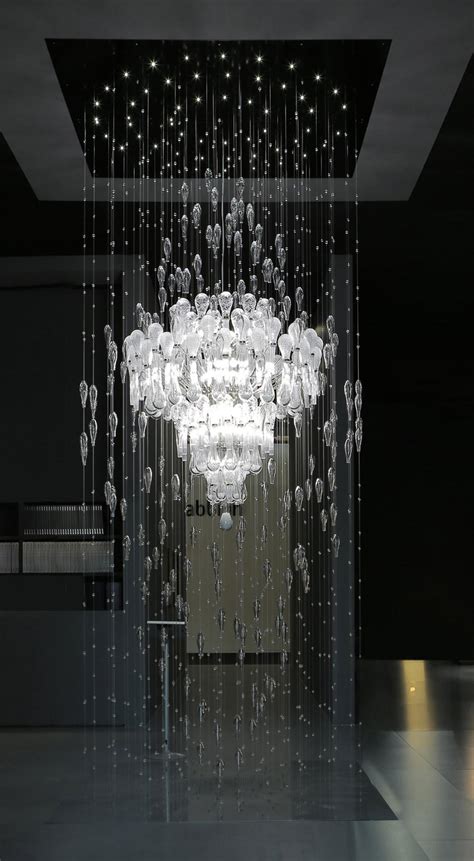 The hall is being lighted by a classy chandelier. Large Modern Foyer Chandelier ILA575K130C - MURANO IMPORTS™