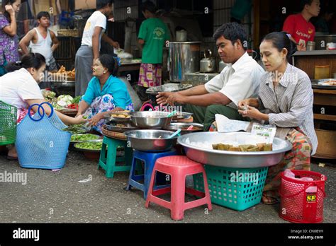 Local Burmese In An Early Morning Street Market In Central Rangoon