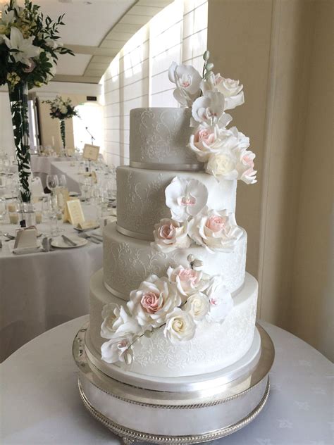 sugar flower cascade wedding cake with blush and ivory sugar roses and orchids wedding cake roses