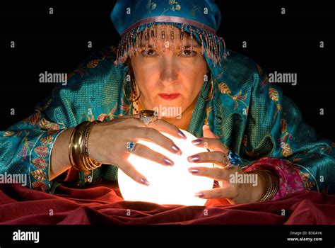 A Gypsy Fortune Teller Brings Her Crystal Ball To Life To Read The Stock Photo Alamy