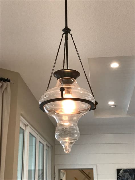A Light Fixture Hanging From The Ceiling In A Kitchen