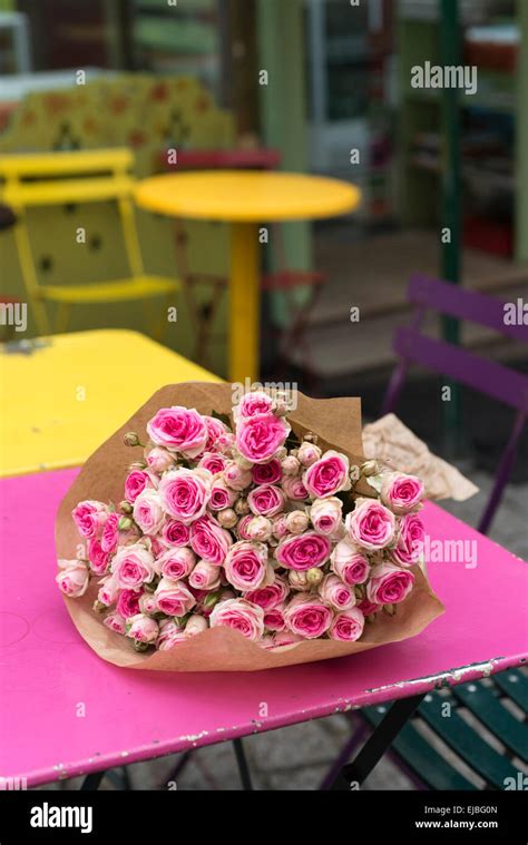 Pink Cut Mimi Eden Spray Roses On Cafe Table Paris France Stock Photo