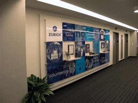 Examples Of Corporate Achievement Walls Using Graphics And Signs