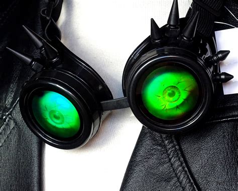 Green Spiky Goggles With Eyes Free Stock Photo - Public Domain Pictures