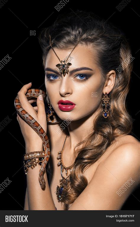 Contact the squirters on messenger. Close up portrait of sexy woman with snake. Beautiful red ...