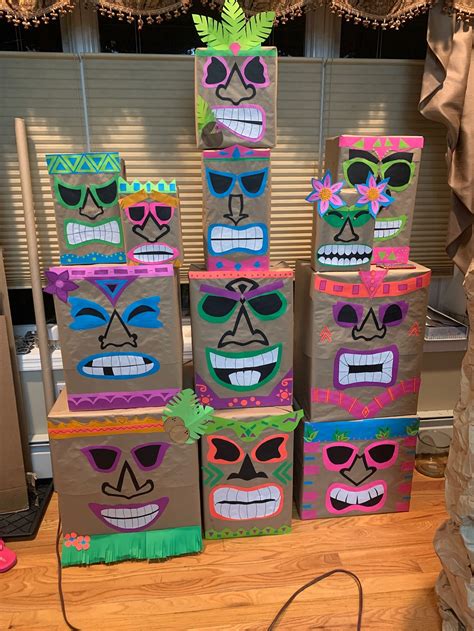 Homemade Tiki Heads Made From Assorted Cardboard Boxes Wrapped In