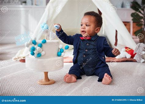 Cute One Year Old Baby Boy Having A Home Party With Birthday Cake Stock