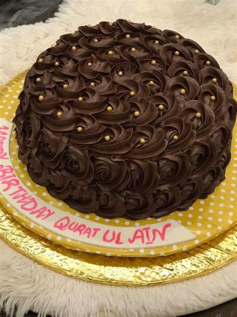 A very cute cake for first birthday featuring. Get best taste of round chocolate birthday cake|Cakes.com.pk