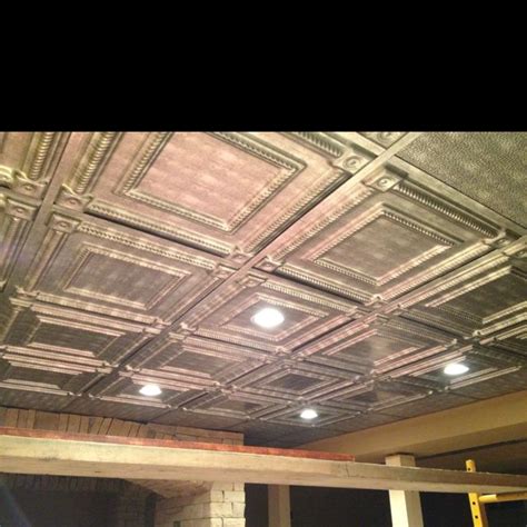 My daughter wanted a headboard made from tin ceiling tiles. Tin ceiling tiles in our basement | Basement renovations ...