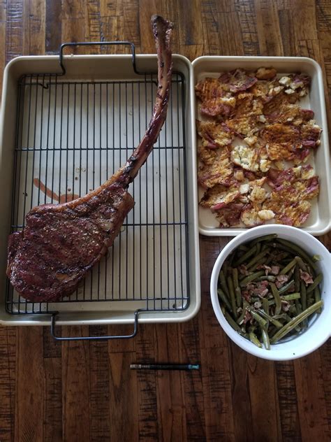 A Oz Tomahawk Ribeye Steak Served Alongside Is Bacon Green Beans And