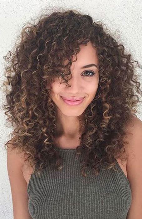 If you have longer hair and want the illusion of bangs without actually cutting your curly hair, then this is the perfect way to achieve them. 5.-Long-Curly-Hair-with-Side-Bangs - beautyFY