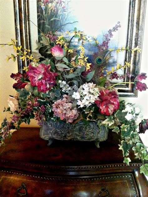 This classic farmhouse dining table is formed from reclaimed pine and hand finished to preserve the natural beauty and variation of the wood grain. Traditional Floral Arrangement, Formal Dining Table ...