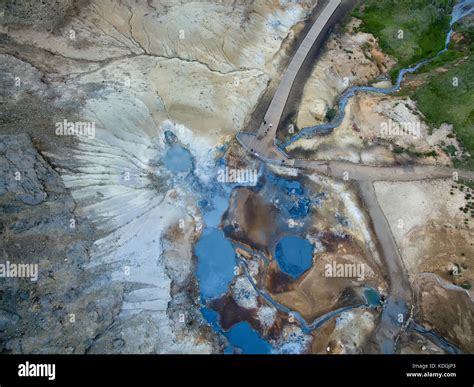 Aerial View Of A Geothermal Hotspot In Iceland Blue Mudpools With Red