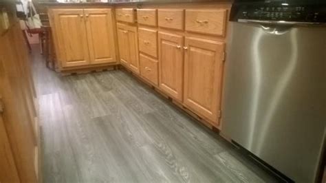 Updating a kitchen with oak cabinets. Allure Ultra 7.5 in. x 47.6 in. Aspen Oak Black Luxury ...