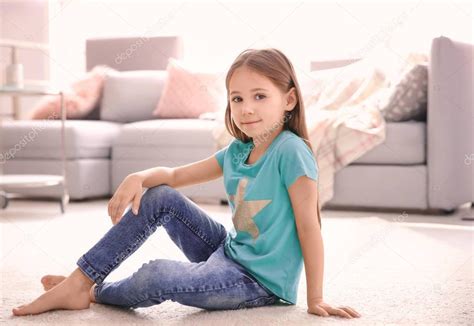 Cute Little Girl Sitting Floor Home — Stock Photo © Belchonock 175405496