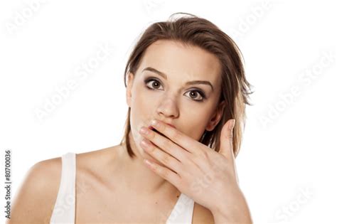 Shocked Young Beautiful Girl With Hand Over Her Mouth Buy This Stock