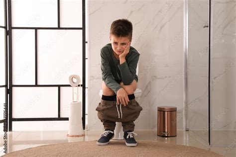 Boy Suffering From Hemorrhoid On Toilet Bowl In Rest Room Stock Photo Adobe Stock