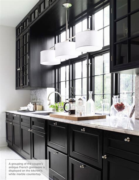 Gorgeous kitchen nice combination of black granite countertops. One Color Fits Most: Black Kitchen Cabinets
