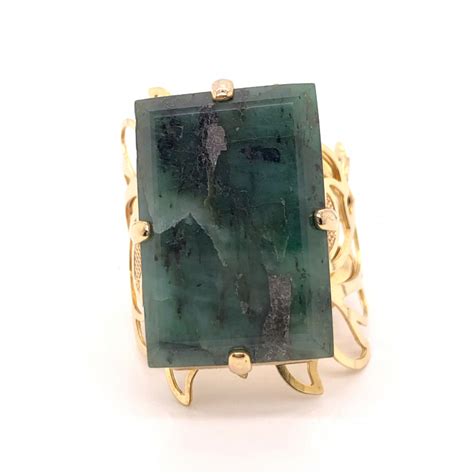 Due to improved manufacturing processes that closely simulate the looks and feel of natural grass, this is the obvious choice for a green alternative synthetic lawn: Large Natural Brazilian Emerald in Gold Plated ring