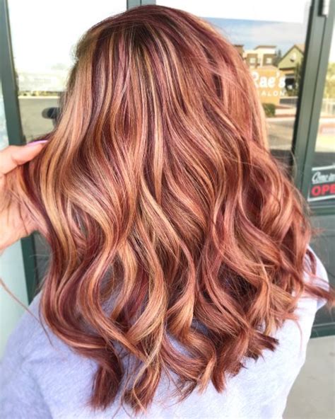 Black, white and blonde color highlights on perfectly cut hair is trendy and attractive. 19 Best Red and Blonde Hair Color Ideas of 2020