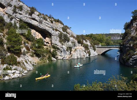 Tourists Canoeing And On Pedalo Or Paddle Boat On Lower Verdon Gorge Or