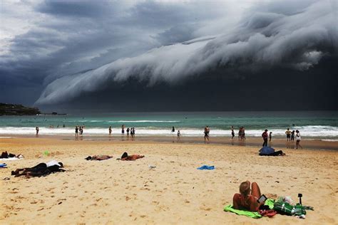Sunbathers On Bondi Beach As Storm Clouds Move In Over Sydney New