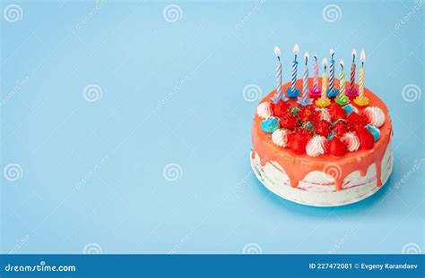 Birthday Cake With Burning Candles On A Blue Stock Image Image Of