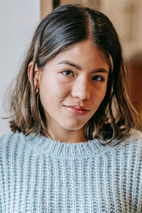 Hispanic lady in room near wall · Free Stock Photo