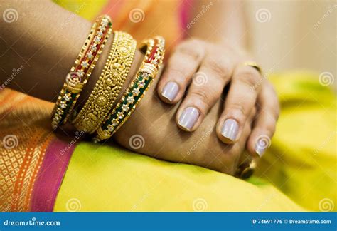Close Up Of Hand With Gold Bangles Stock Photo Image Of Women Focus