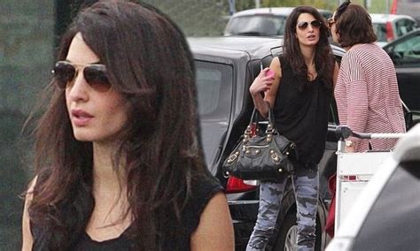 Amal Alamuddin Looks Chic After Flight To Milan With Mother Baria