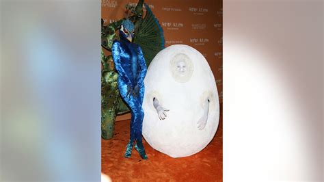 heidi klum dresses up as a giant peacock for halloween after teasing with stripped down photo