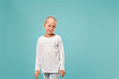 Doubtful Pensive Teen Girl Rejecting Something Against Blue Background