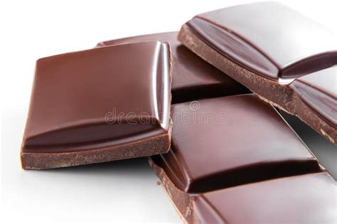 Macro Photo Of Milk Chocolate Bars On A White Broken Pieces Placed In