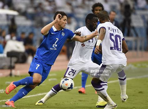 Saudi's Al-Hilal player Thiago Nevez vies for the ball with UAE's
