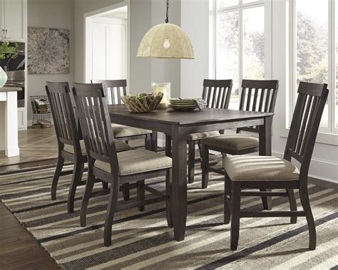Cutout design of chair back splats helps create an open and airy dining room space. Signature Design by Ashley Dresbar 7-Piece Rectangular ...