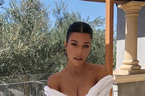 Kourtney Kardashian Rivals Sister Kim In Cleavage Baring Bath Robe