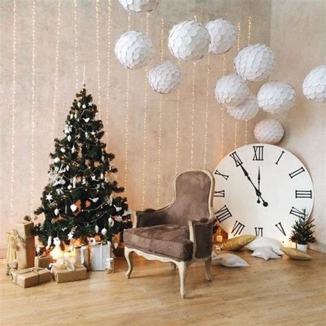 A Living Room Decorated For Christmas With A Clock On The Wall And