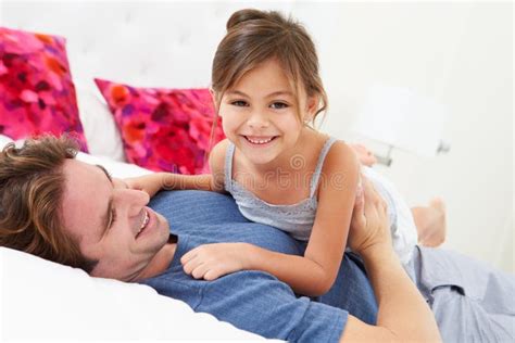 Father And Daughter Lying In Bed Together Stock Image Image Of