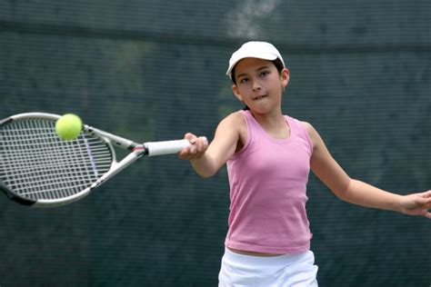A Young Girl In Pink And White Playing Tennis Outdoors King Daddy Sports