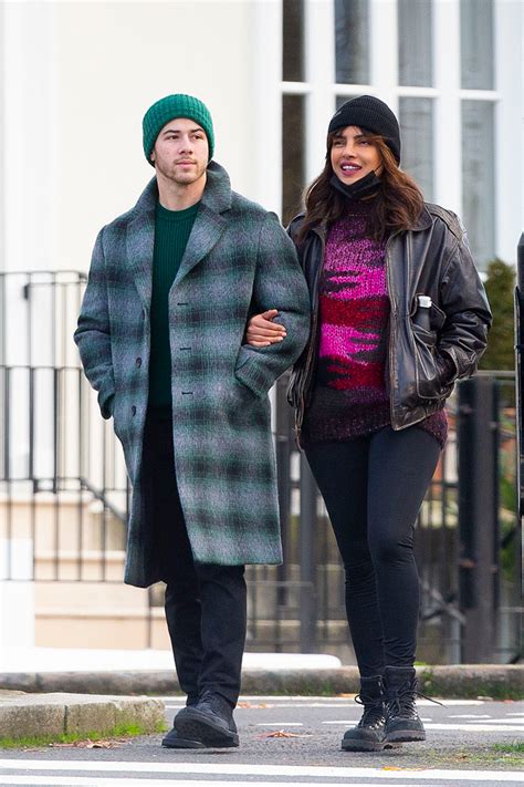 Priyanka chopra jonas and nick jonas | credit: Priyanka Chopra & Nick Jonas Cuddle In Front Of Christmas ...