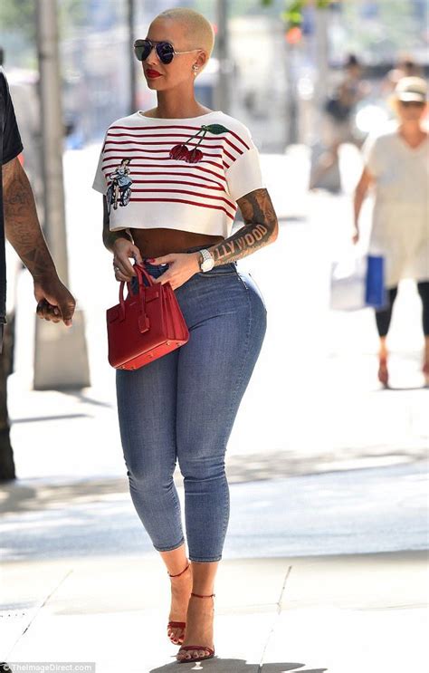 Amber Rose Flaunts Hourglass Curves In Crop Top And Painted On Jeans